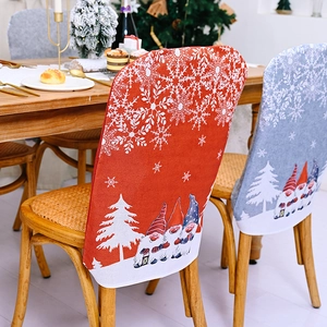 Christmas chair covers featuring gnomes and snowflakes on rustic linen fabric