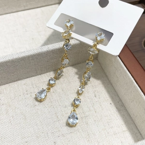 Elegant long gold tassel earrings with light blue rhinestones and teardrop crystal drops