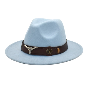 Detail of light blue wool fedora featuring a leather band and silver bull head ornament