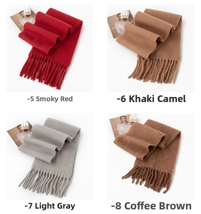 Detail of wool scarves in wine red, khaki, grey and coffee with classic fringed edges