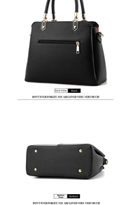 Detail view of the pebbled PU leather bag back with zipper pocket and four metal feet