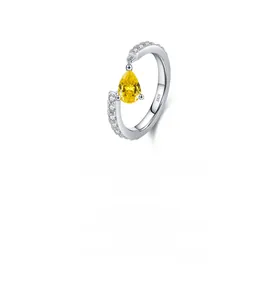 Macro view showing the S925 silver hallmark on the polished pear-cut yellow gem ring
