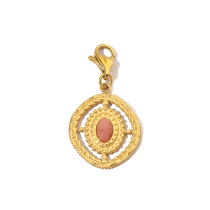 Macro detail of a gold-plated charm with pink stone and lobster clasp for necklaces