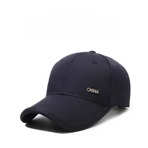 Detail of navy blue baseball cap showing reinforced brim and metal CHINA side logo