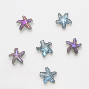 Macro detail of starfish shaped glass crystals with iridescent blue and purple finish