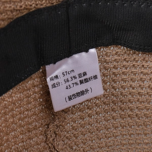 Linen blend knit sun hat interior detail with 57cm size label and breathable texture