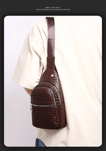Detail view of brown woven texture on men's PU leather crossbody bag with metal zipper