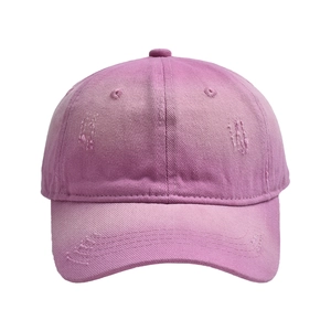 Detailed view of the purple distressed cotton twill fabric and vintage torn details on the cap