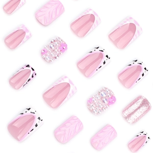 Pink 3D wavy press-on nails set with pearls, floral accents, and glittery French tips