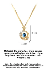Detail of gold moon star necklace showing 2.4cm pendant with blue beads and zircon stones