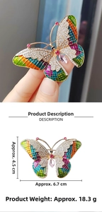 Detailed view of colorful enamel butterfly brooch with dimensions 6.7cm by 4.5cm