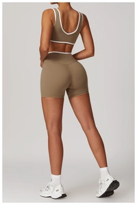 Detail view of back crossover straps and contrast piping on high-waist fitness set