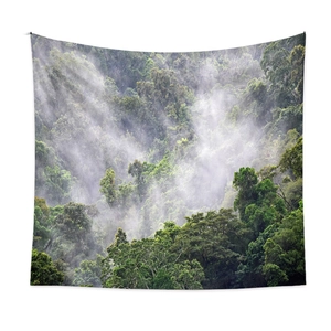 Bohemian forest mist tapestry for room decor featuring green trees and ethereal fog