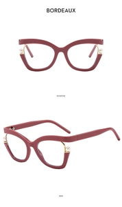 Detail view of Bordeaux cat-eye glasses frame with elegant pearl accents and side profile