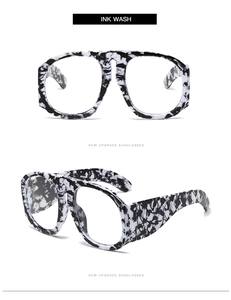 Detail of oversized black and white ink wash pattern frames with artistic marble finish