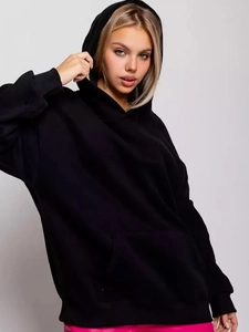 Close-up of black hoodie with drop shoulders and a spacious front kangaroo pocket