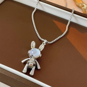 Mechanical silver rabbit necklace with iridescent gem stone in a brown gift box