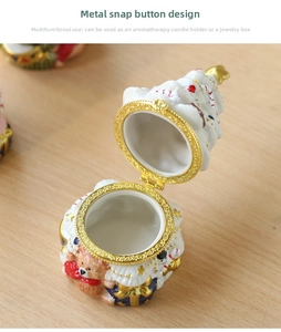 Close-up of ceramic Christmas tree trinket box with bear detail and metal gold clasp