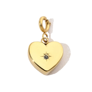Macro detail of golden heart pendant with starburst diamond inlay and spring clasp