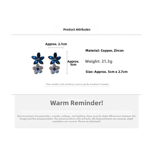 Detail view of flower earrings with blue and white zircons, measuring 5cm by 2.7cm