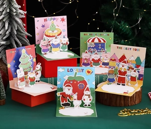 Detailed view of 3D Christmas pop-up cards set with envelopes on festive green background