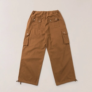 Detail view of retro cargo pants back side with adjustable drawstring and flap pockets