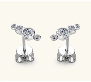 Macro shot of S925 silver stud earrings with 0.18CT moissanite and hallmark engraving