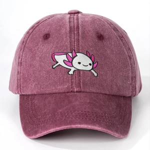 Detailed close-up of cute pink axolotl embroidery on washed purple cotton baseball cap