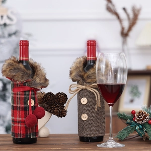 Christmas wine bottle covers in plaid and herringbone fabric with faux fur collars