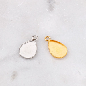 Golden and silver teardrop geometric stone trays for DIY jewelry making on marble