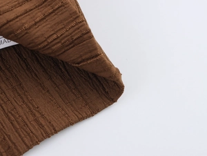 Detail shot of dark brown ribbed knit fabric texture with high elasticity for beachwear
