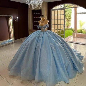 Elegant off-shoulder light blue ball gown with floral embroidery and sparkling glitter