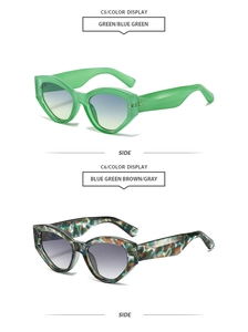 Detail view of cat eye sunglasses in green and tortoiseshell frames with gradient lenses