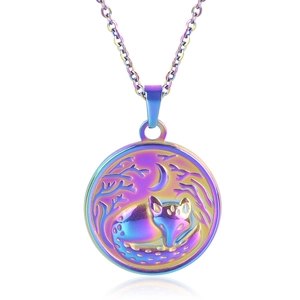 Macro shot of iridescent rainbow fox and moon relief on circular stainless steel pendant