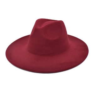 Close-up of a burgundy wool fedora hat with a flat wide brim and classic crown design