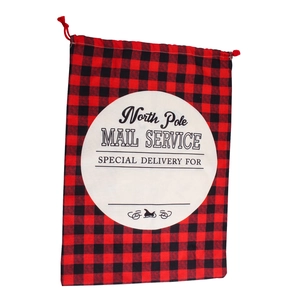 Large red and black plaid Christmas drawstring gift bag with North Pole mail print
