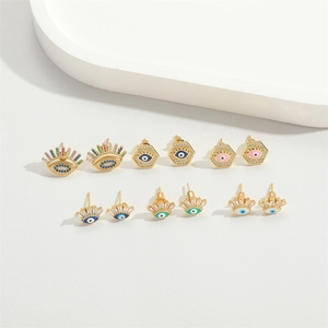 Macro detail of Evil Eye stud earrings set with colorful cubic zirconia and gold plating