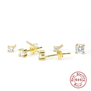 Detailed macro of gold plated S925 sterling silver stud earrings with clear zircon stones