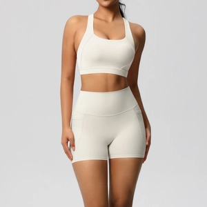 Close-up of the U-neck sports bra and high-waist shorts in off-white brushed fabric