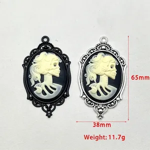 Gothic skull cameo pendant in antique silver and black finish with floral frame