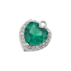 Macro detail of heart-shaped 18K gold pendant with green gemstone and zircon halo
