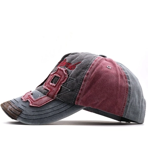 Close-up of vintage baseball cap with distressed brim, number 19 patch and York embroidery