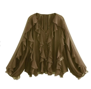 Detail of a brown chiffon blouse featuring layered ruffles and a deep V-neck with buttons