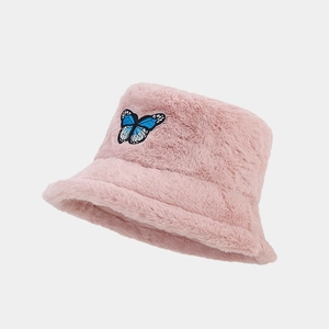 Detail of plush pink bucket hat with high-quality blue butterfly embroidery patch