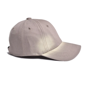 Detail of vintage washed baseball cap showing gray distressed cotton twill and stitching