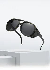 Detail of aviator frame sunglasses with unique yellow splatter pattern and side shields