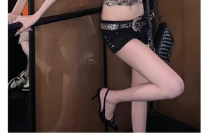 Close-up of Y2K punk style wide belt with sparkling rhinestones and metal rivets decoration