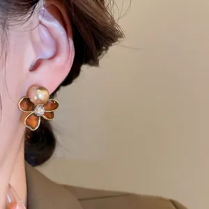Retro flower pearl stud earrings with 18k gold plating and brown enamel petals