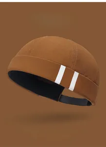 Close-up of brown cotton Miki hat with white stripes and various color swatch options