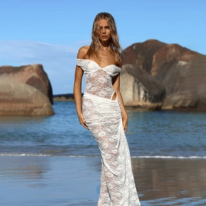 Elegant white lace two-piece beach dress set with backless design and side cutout details